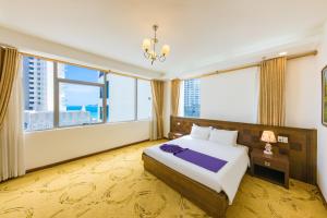 Ένα ή περισσότερα κρεβάτια σε δωμάτιο στο Central Nha Trang Hotel & Business