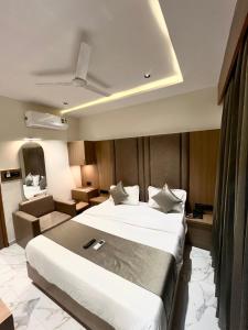 Postel nebo postele na pokoji v ubytování Hotel Pulse Town