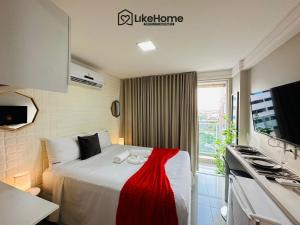 Ilha da RestingaMar Bello的酒店房间有一张床，上面铺着红毯子 更多33张照片