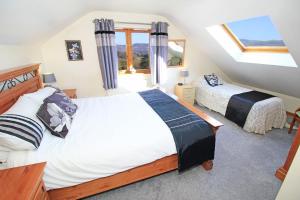 Ένα ή περισσότερα κρεβάτια σε δωμάτιο στο Artist's Cottage