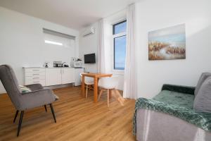 a living room with a couch and a table at Casa Formosa - HOST & CHILL in Porto Formoso