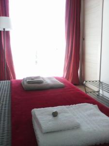 Voodi või voodid majutusasutuse B&B Aria d'Argento & Relax Home toas