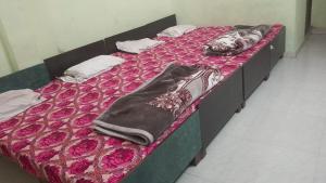 Postel nebo postele na pokoji v ubytování Hotel Ma Parvati Residency