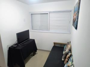 Μια τηλεόραση ή/και κέντρο ψυχαγωγίας στο Casa em Boiçucanga - Temporada, finais de semana e feriados