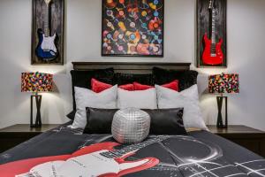 a bedroom with a bed with guitars on it at Music Hall Brand New 2BR 2 and a half BA in San Angelo