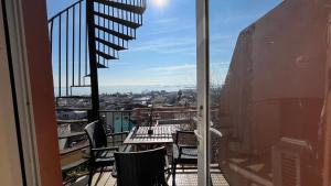 a balcony with chairs and a table with a view at Hotel Tulip House in Istanbul