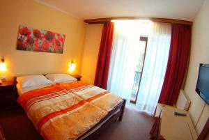 Postel nebo postele na pokoji v ubytování Hotel Canin