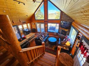 an overhead view of a living room in a log cabin at Stunning 2 Bedroom 1.5 Bath Cabin on 3.5 Acres in Bordenville