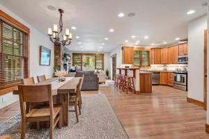 a kitchen and dining room with a table and chairs at Cozy Spacious Mountain Home Close To Everything in Minturn