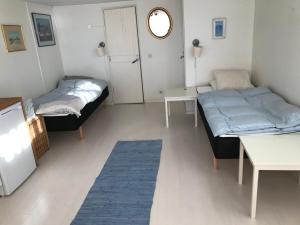 Postel nebo postele na pokoji v ubytování Havsnära studio