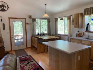 a kitchen with a large island in the middle at Beautiful Secluded Rocky Mountain Hideaway in Bordenville
