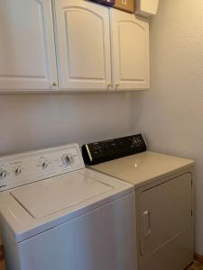a kitchen with a white stove and a dishwasher at Beautiful Secluded Rocky Mountain Hideaway in Bordenville