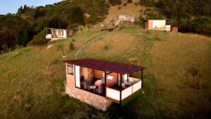 an aerial view of a small house on a field at Glamping Waná in Sutatausa