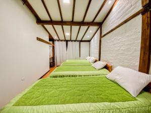 Postel nebo postele na pokoji v ubytování Chuza Longa Home