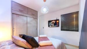 Voodi või voodid majutusasutuse Acogedor Apartasol cerca al Parque del Cafe toas +37 fotot