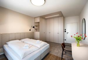 A bed or beds in a room at Natur Resort