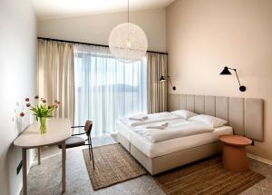 A bed or beds in a room at Natur Resort