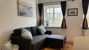 Posezení v ubytování Kleines Grachtenhaus - Simmerdeis an der Gracht