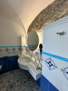 a bathroom with a sink and a mirror at Agriturismo Miramare in Agerola