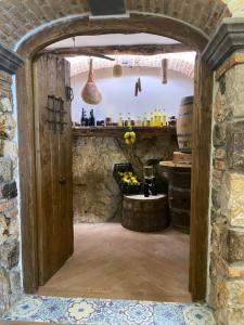an entrance to a wine cellar with an archway at Agriturismo Miramare in Agerola +38 photos