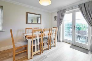 a dining room with a table and chairs and a window at Host & Stay - The Fold in Rock +24 photos
