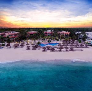 an aerial view of a resort on the beach at Grand Oasis Tulum Riviera - All Inclusive in Akumal