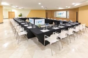 a long table and chairs in a large room at The Grand Oasis Cancun - All Inclusive in Cancún