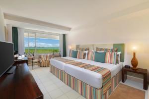 Postel nebo postele na pokoji v ubytování Grand Oasis Palm - All inclusive