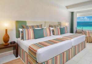 Postel nebo postele na pokoji v ubytování Grand Oasis Palm - All inclusive