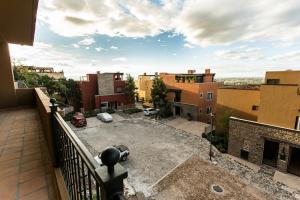 a balcony with a view of a parking lot at Villa Jade in San Miguel de Allende