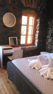 Ένα ή περισσότερα κρεβάτια σε δωμάτιο στο Domna's House