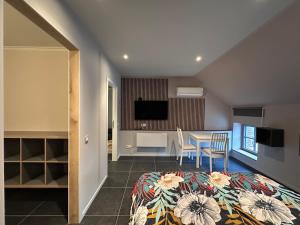 Televisyen dan/atau pusat hiburan di Viticolo Chambres d'hôtes