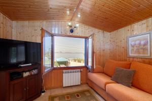TV a/nebo společenská místnost v ubytování Tranquilidad junto al mar by CABANA Rentals