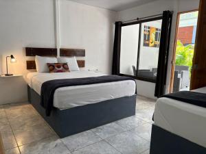 Postel nebo postele na pokoji v ubytování Playa Negra Home's CR