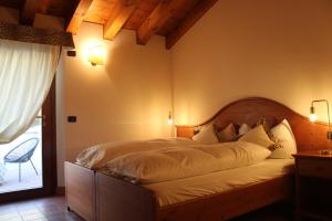 Postel nebo postele na pokoji v ubytování Agriturismo Al Credazzo