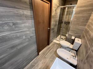 a bathroom with two toilets and a sink at The Old Mint Residence 4 in Valletta +11 photos