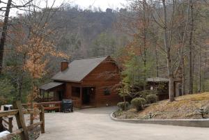a log cabin in the middle of the woods at Reflections in Sevierville
