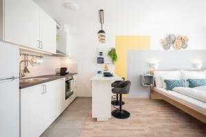 Kuchyňa alebo kuchynka v ubytovaní River Sunshine Apartment