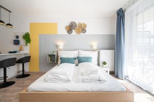Posteľ alebo postele v izbe v ubytovaní River Sunshine Apartment