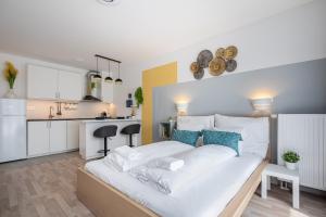 Posteľ alebo postele v izbe v ubytovaní River Sunshine Apartment