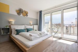 Posteľ alebo postele v izbe v ubytovaní River Sunshine Apartment