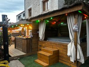 a outdoor deck with a bed in a building at Les Chambres de Paulette à Theme LA JUNGLE ROOM in Sainte-Marie-la-Mer +23 photos