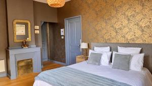 Letto o letti in una camera di Maison d'hôtes Le Parc