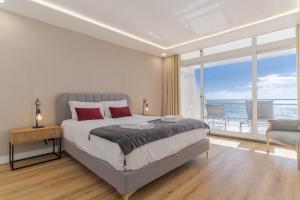 Ένα ή περισσότερα κρεβάτια σε δωμάτιο στο Hip Heaven Apartment on Beach +22 φωτογραφίες