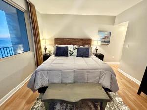 a bedroom with a bed and a large window at Amazing views! Great beachfront Panama City Condo in Panama City Beach +44 photos