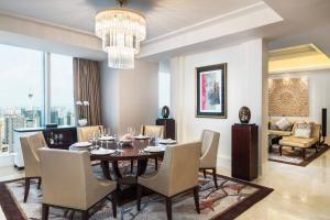 a dining room with a table and chairs at The St. Regis Chengdu in Chengdu