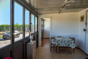 a room with a table and a view of a car at Casa al mare holidays in Casa Margherita