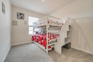 a white bunk bed in a white room with a ladder at Davenport Home w/ Pool Access & Patio! in Davenport +24 photos