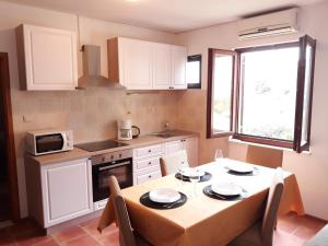 Kuchyň nebo kuchyňský kout v ubytování Gabrijela