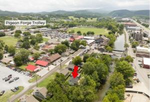 a view of a town with a red arrow pointing to a town at River Cottage in Pigeon Forge